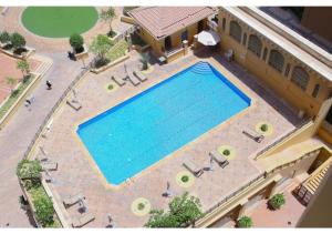 an overhead view of a large swimming pool with chairs at JBR The Walk Sadaf Suites - Fully Upgraded By Livbnb in Dubai