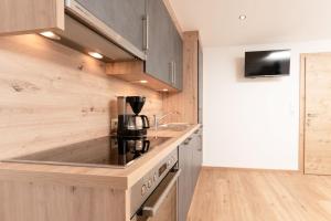 Kuchyň nebo kuchyňský kout v ubytování Bergnest Oetztal - Appartements + 20 fotografií