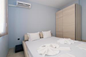 Кровать или кровати в номере Mars Apartments in Tryavna Beach Complex