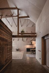 a large room with a table and a wooden wall at Hello Sunnanhed 