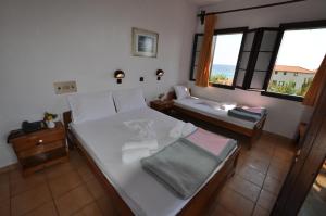 Postel nebo postele na pokoji v ubytování Hotel Sylvia