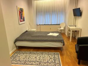 Postel nebo postele na pokoji v ubytování Hotel 9 små hjem