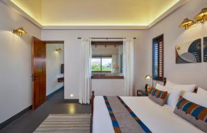 Postel nebo postele na pokoji v ubytování Viveda Wellness Resort + 37 fotografií