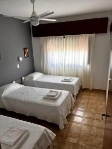Una cama o camas en una habitación de Hotel Fariña