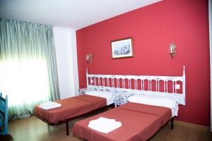 מיטה או מיטות בחדר ב-Las Brasas De Eddy