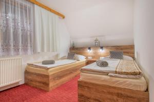Postel nebo postele na pokoji v ubytování Penzión Ciriak