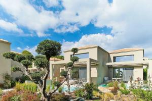A garden outside Cavo Delea Villas & Suites