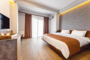 Katil atau katil-katil dalam bilik di Ivy Hotel
