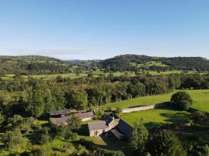 an aerial view of a farm in a field at Tranquil getaway on edge of the Brecon Beacons in Llandovery