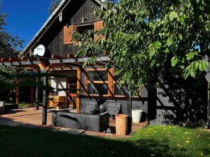 a house with a pergola in front of it at Moon House in Przesieka