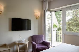 TV a/nebo společenská místnost v ubytování Silva Hotel Splendid