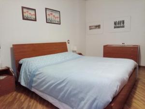Кровать или кровати в номере Casa Bondone