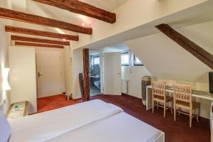 Postel nebo postele na pokoji v ubytování Hotel Kiwano Graz