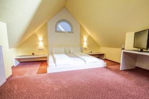 Postel nebo postele na pokoji v ubytování Hotel Kiwano Graz