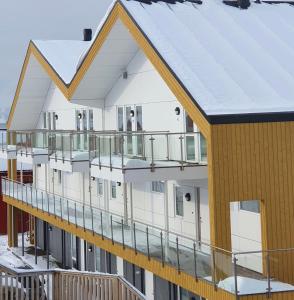 an aerial view of a building with a balcony at Lofoten Seaside in Ballstad