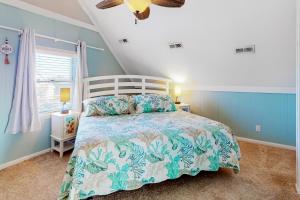 a bedroom with a large bed with blue walls at Knot a Care in Buxton +24 photos