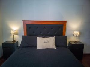 Кровать или кровати в номере Laprida y Trejo Apartamento
