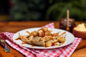 a plate of food with shrimp and potatoes on a table at KACLLA, The Healing Dog Hostel in Lima