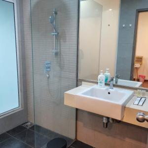 a bathroom with a sink and a shower at Romance in de house 3-5pax Two Parking Free, There is a shopping mall downstairs in Kuala Lumpur