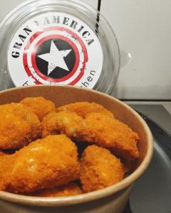 a bowl of food sitting on a stove with a captain america sign at СЕЙФ: міні-готель 24х7 in Ivano-Frankivsʼk