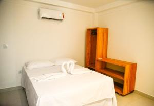 Postel nebo postele na pokoji v ubytování Cond. Fechado, na Ponta do Mutá + 25 fotografií