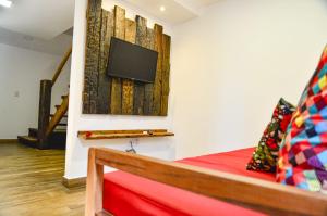 TV a/nebo společenská místnost v ubytování Cond. Fechado, na Ponta do Mutá