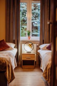 Postel nebo postele na pokoji v ubytování Apartament Zielona 11