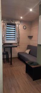 a living room with a bed and a piano at HARCÓWKA 2 in Złoty Stok +35 photos