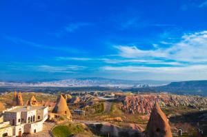 a view of the badlands from the top of a mountain at Millstone Cave Suites Hotel in Uchisar