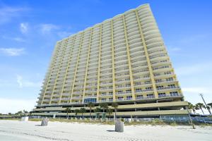 a large apartment building on the beach with snow at Emerald Isle by Panhandle Getaways in Panama City Beach