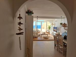 a kitchen and dining room with a view of the ocean at la ventana al mar in Jávea