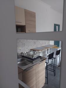 Kuchyň nebo kuchyňský kout v ubytování Scala Studio Apartments + 9 fotografií