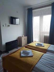 Ліжко або ліжка в номері Scala Studio Apartments