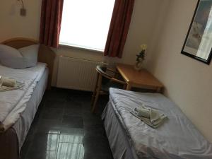 Postel nebo postele na pokoji v ubytování Villa Dünenblick 02