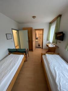 Łóżko lub łóżka w pokoju w obiekcie Waldrestaurant VIDA