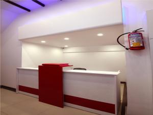 a gas station with a red and white counter at Hotel Briteway in Mumbai