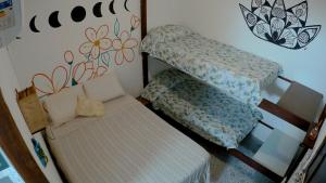 a small room with two stairs and a couch at Hostel FreeDive Inn in Morro de São Paulo