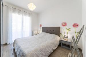 Posteľ alebo postele v izbe v ubytovaní Appartement vue mer, 3 chambres, climatisation, WiFi, plage à pied
