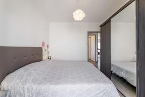 Posteľ alebo postele v izbe v ubytovaní Appartement vue mer, 3 chambres, climatisation, WiFi, plage à pied