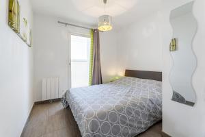 Posteľ alebo postele v izbe v ubytovaní Appartement vue mer, 3 chambres, climatisation, WiFi, plage à pied