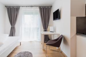 Telewizja i/lub zestaw kina domowego w obiekcie Appartement Graz - Ihr erstklassiges Zuhause fernab von Zuhause