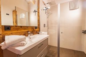 a bathroom with a sink and a shower at Chalet Dinkel in Niedernsill in Niedernsill