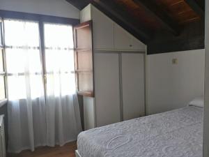 Postel nebo postele na pokoji v ubytování LA CASA ROJA