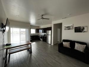 a living room with a couch and a table at Longhorn Flats in Loving