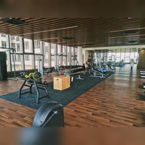 a gym with several treadmills and exercise equipment in it at D'RZ Muslim Seaview Homestay Bali Residence in Malacca