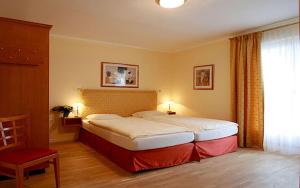 Postelja oz. postelje v sobi nastanitve Hotel Garni Golf