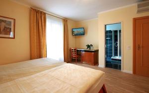 Postelja oz. postelje v sobi nastanitve Hotel Garni Golf