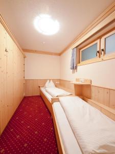 Letto o letti in una camera di Sagritzerwirt