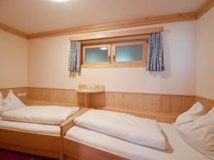 Letto o letti in una camera di Sagritzerwirt