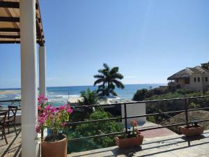 a view of the beach from the balcony of a house at blue BOCANA in Santa Cruz Huatulco